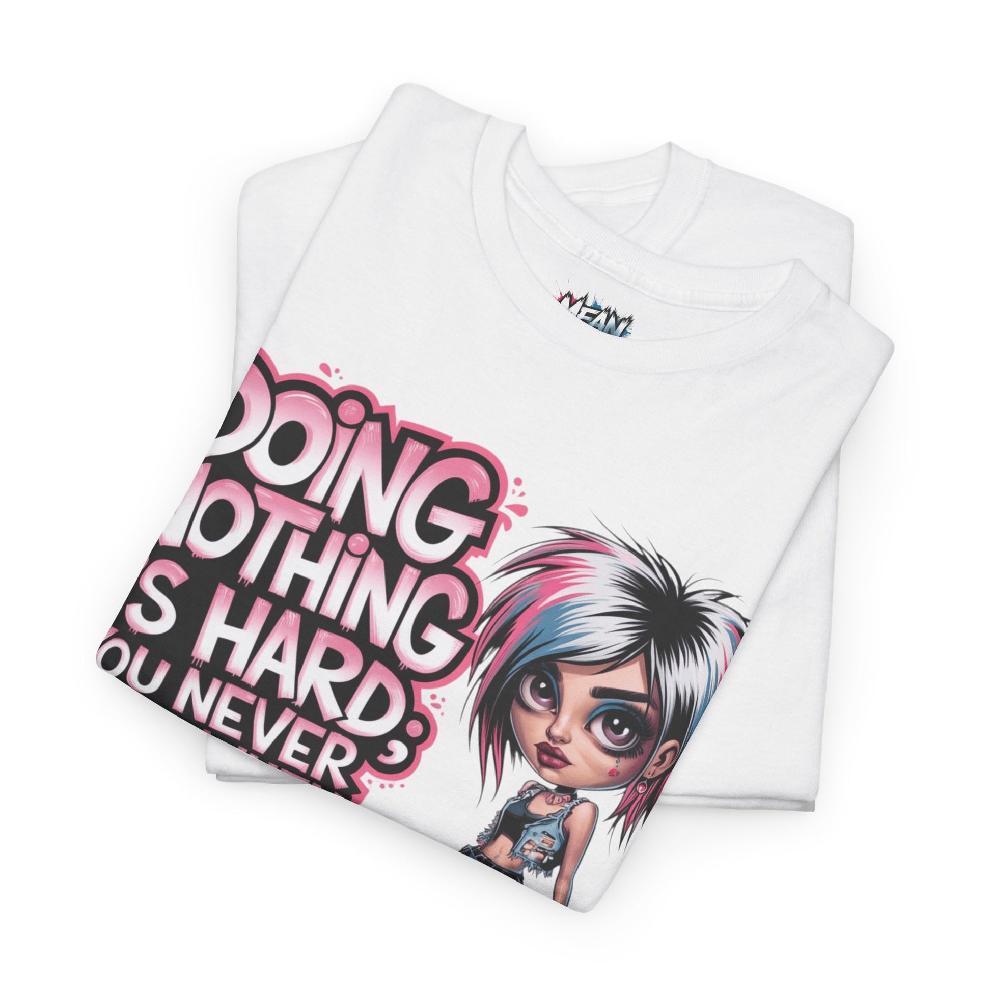 Folded white tee of graphic design – illustrated woman with ‘Doing Nothing Is Hard’ text”