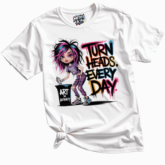 Close-up flatlay of the white 'Turn Heads Every Day' tee by Mean Az, showcasing bold empowering text design on a crisp cotton fabric for fierce everyday vibes.