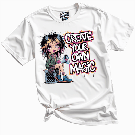 Close-up flatlay of white “Create Your Own Magic” tee highlighting bold graphic print on soft fabric — empowering women’s tee with serious attitude.

